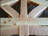 Close up of hand hewn mortise and tenon truss
